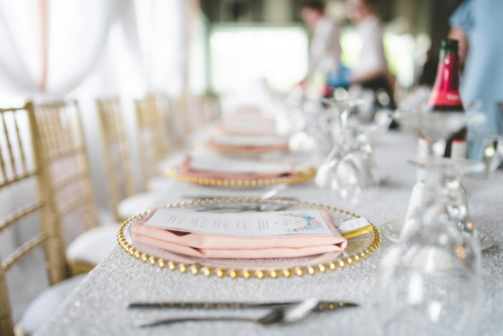 Menu Card and Table Napkin on Top of a Plate